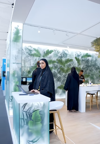 The RTA COP28 stand by Studio Königshausen in Dubai boasts an avant-garde design, featuring illuminated walls adorned with lush greenery, shaping an interactive, futuristic city model.